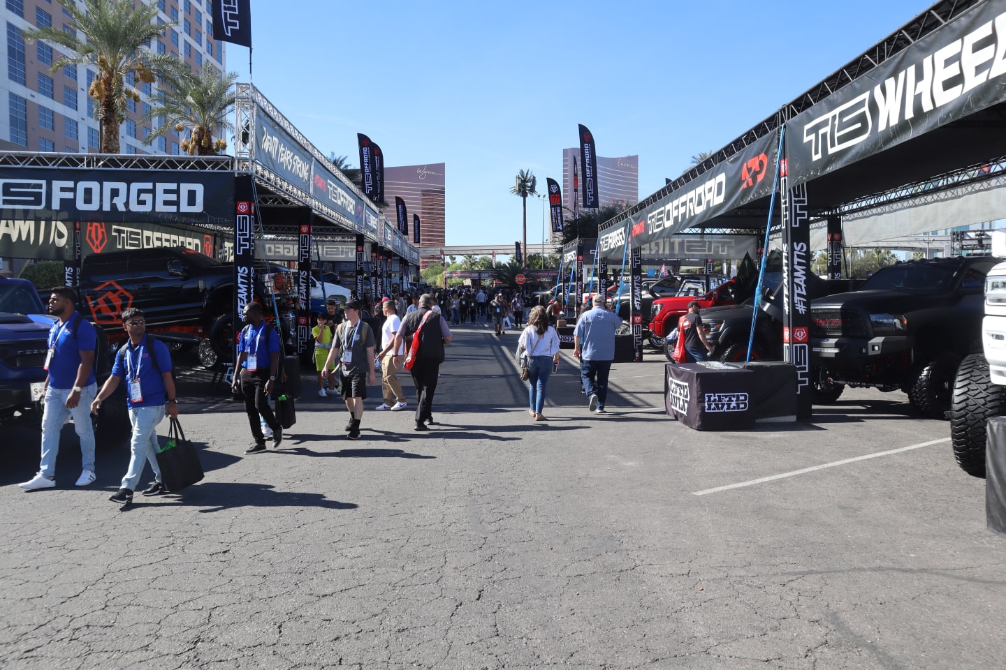 People walking around outside at the SEMA Show 2023